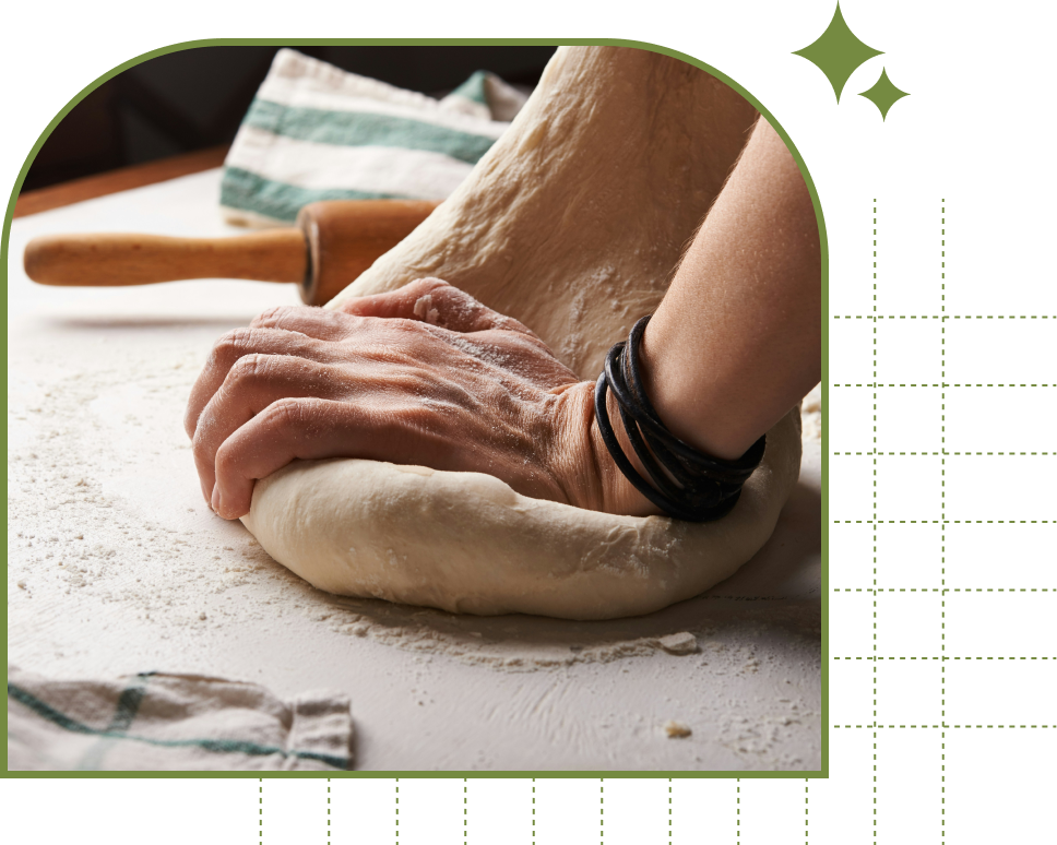 arms kneading a huge dough